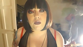 Fat Domme Tina Smokes A Cigarette In A Holder